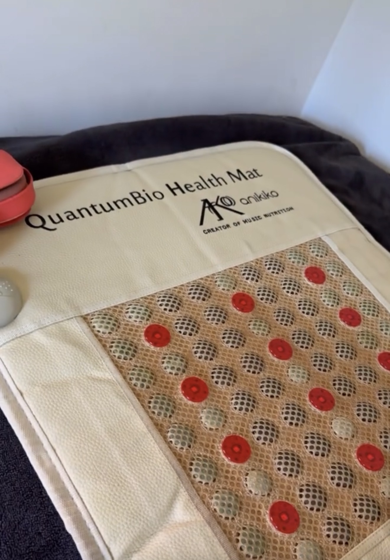 Optional infrared and PEMF comfort mat used during Somatic Place sessions